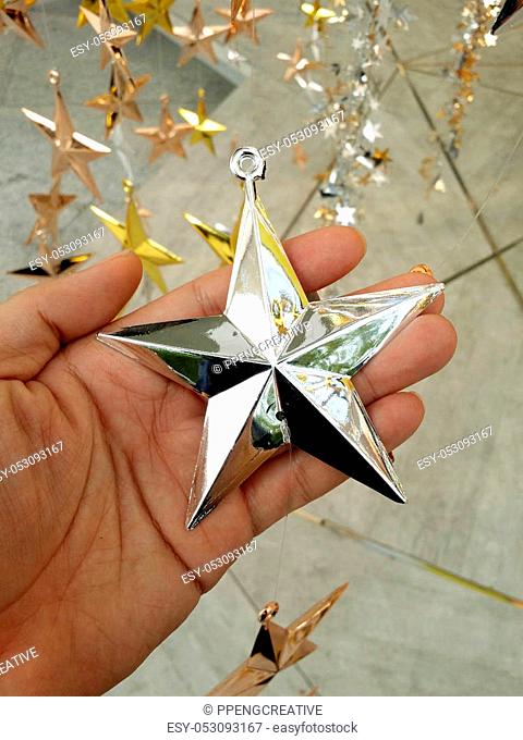 Man Hand and decoration star and Merry Christmas and Happy new years
