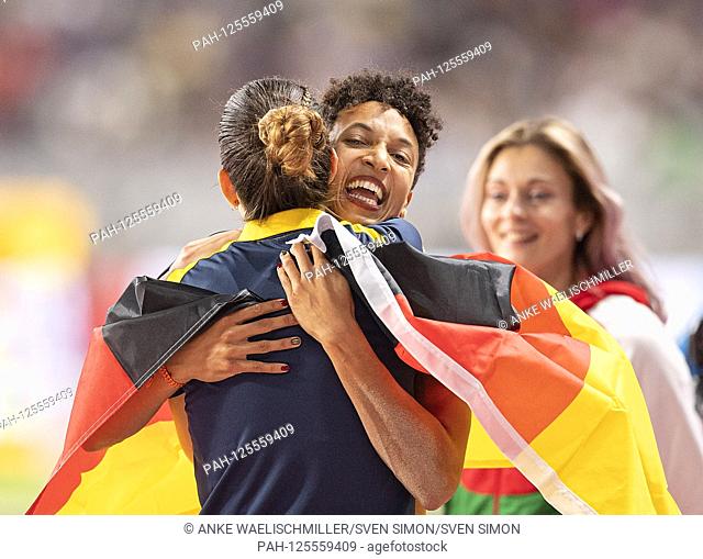 jubilation winner Malaika MIHAMBO (Germany / 1st place) with flag, is hugged by Alina ROTARU (ROU / 6th place). Women's Final Long Jump, on 06.10