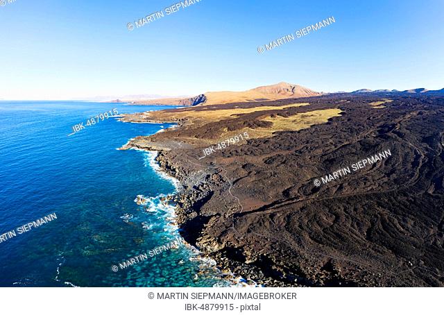 Lava coast, Los Volcanes nature park Park, Tenezar settlement, Montana de Teneza, near Tinajo, drone shot, Lanzarote, Canary Islands, Spain
