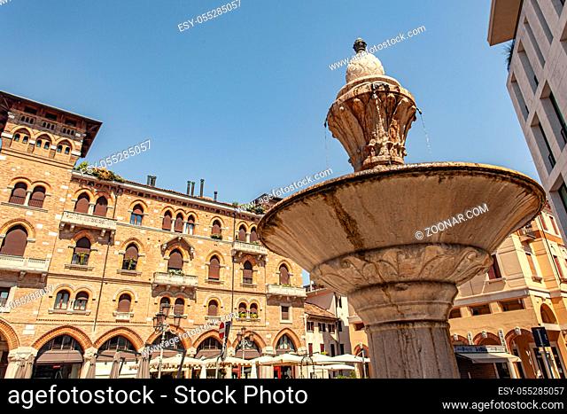 Fountain in Treviso city center in a sunny summer day