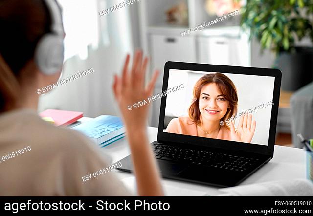 woman with laptop having video call at home