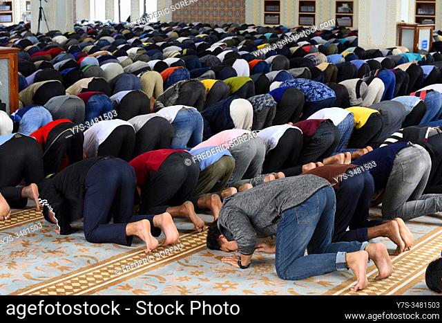Muslim men praying at Friday prayers, Al-Serkal Mosque, Phnom Penh, Cambodia, South East Asia