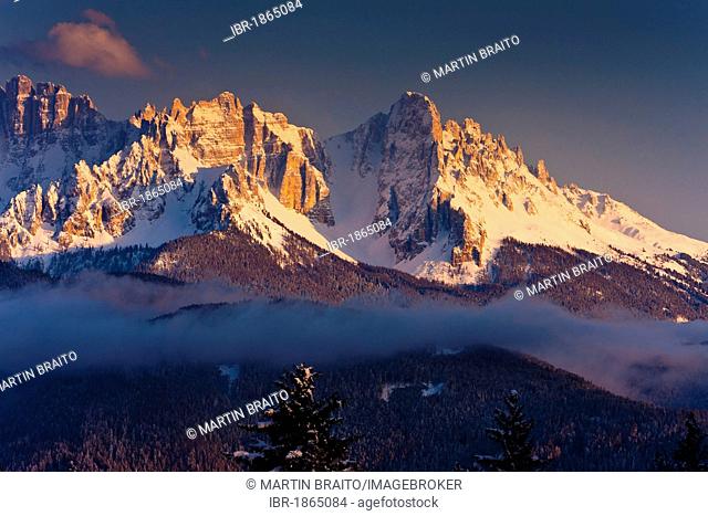 View from the Ritten Plateau to Latemargebirge or Latemar mountain range, at dusk, South Tyrol, Italy, Europe