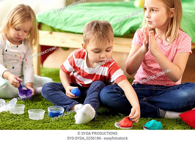 kids with modelling clay or slimes at home