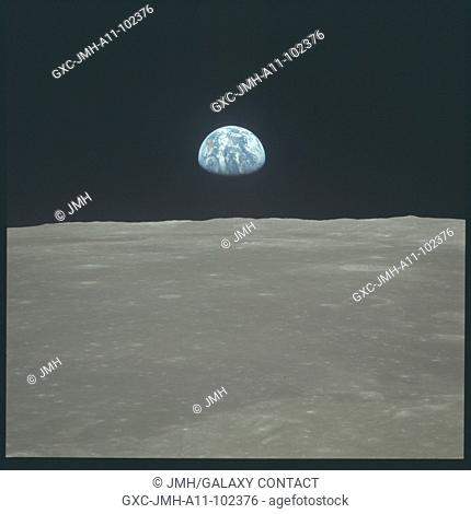 (16-24 july 1969) --- this view of earth rising over the moon's horizon was taken from the apollo spacecraft. the lunar terrain pictured is in the area of...