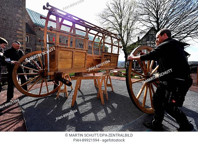 A faithful replica of 'Luthers Reisewagen' (lit. Luther's travel carriage) is set up by workers at Wartburg Castle in Eisenach, Germany, 11 April 2017