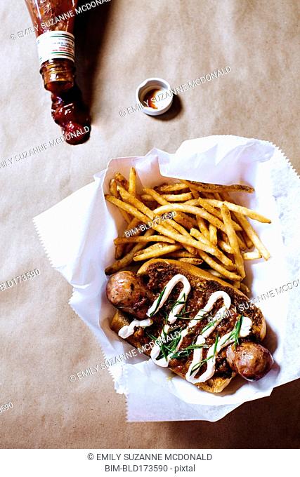 High angle view of chili dog with french fries