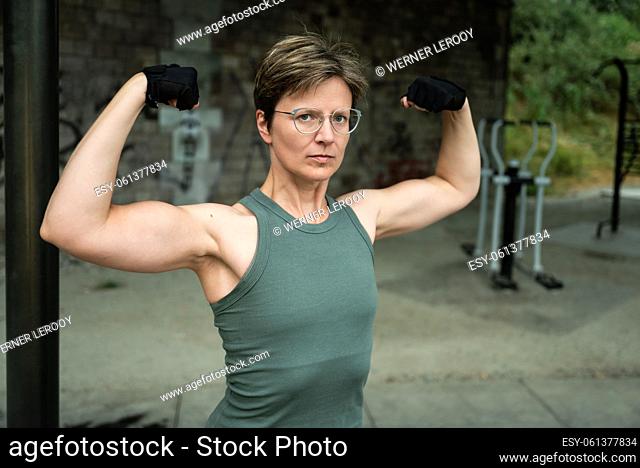 Portrait of a 36 year old white bodybuilder woman, Brussels, Belgium