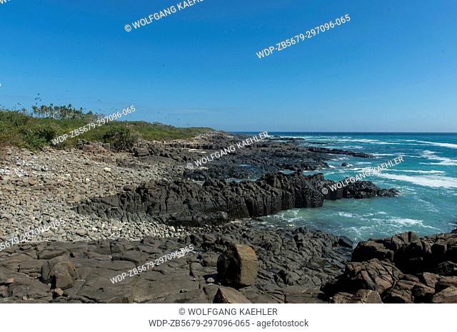 Lava rock formations along the coast of Iguana Island in Panama