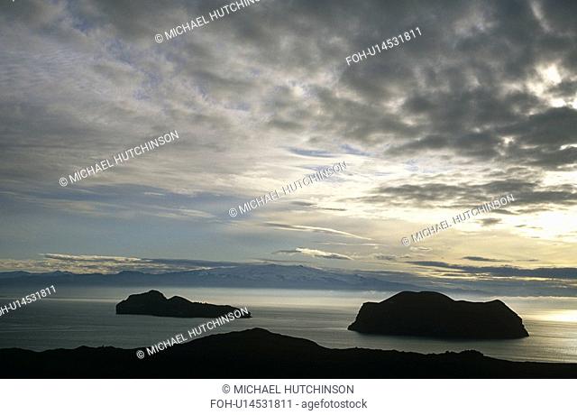 Silhouette of islands and Iceland in the background. Heimaey, Western islands, Iceland