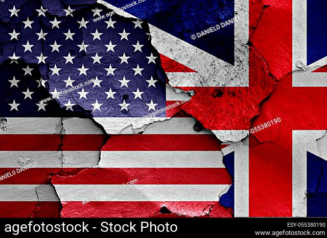 flags of United States of America and UK painted on cracked wall