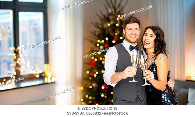happy couple with champagne glasses at party