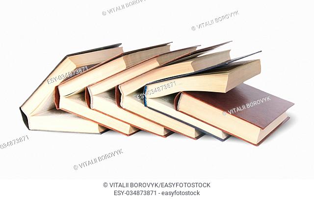 Six old books imbedded in one another front view isolated on white background