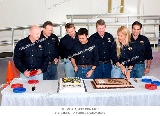 The STS-124 crewmembers celebrate the end of formal crew training with a cake-cutting ceremony in the Jake Garn Simulation and Training Facility at NASA's...