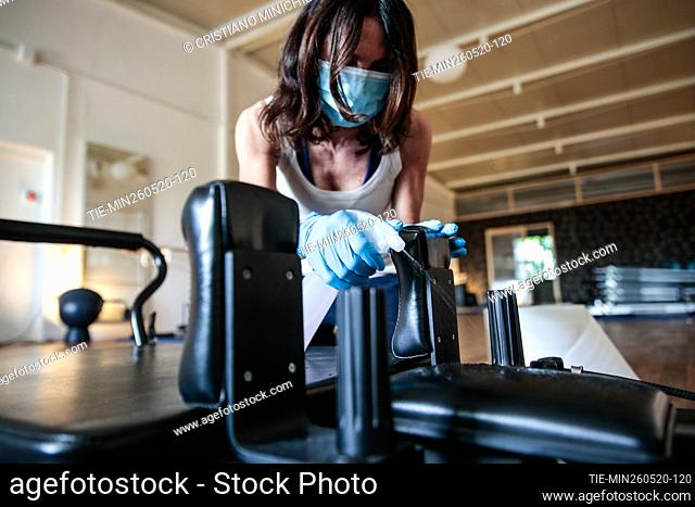 Cleaning of tools in a pilates gym reopened after the lockdown due Covid-19 emergency , Rome, ITALY-26-05-2020