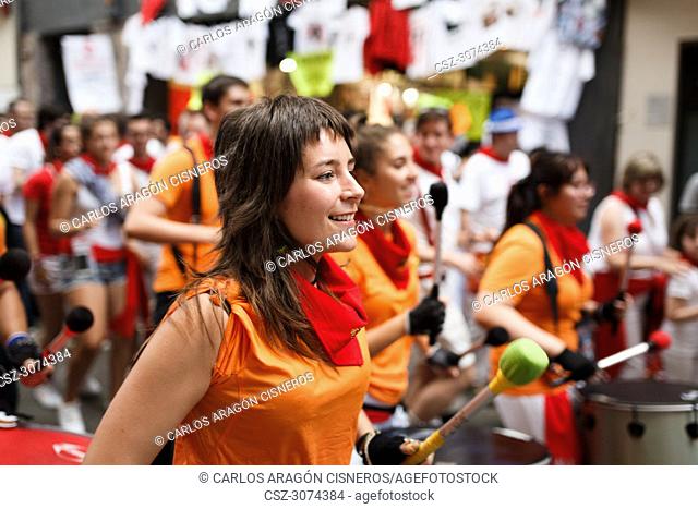 PAMPLONA, SPAIN - JULY 09, 2017: Unidentified people in a popular batucada by the streets of Pamplona in the celebrations of San Fermin