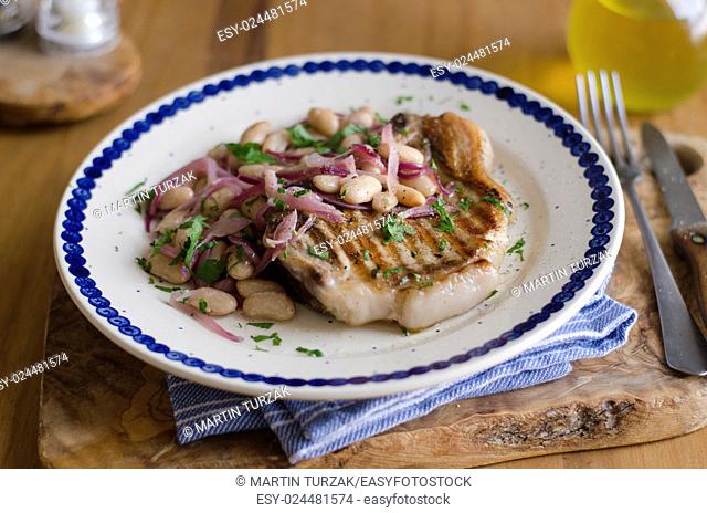 Pork with agrodolce sauce and white beans