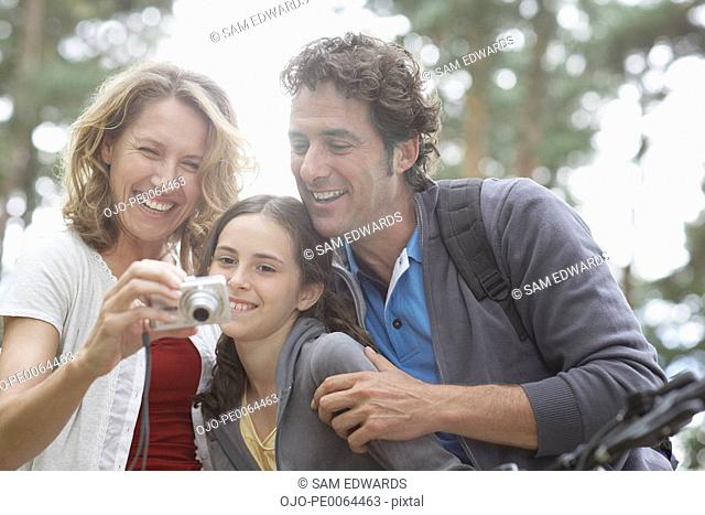 Family looking at camera in woods