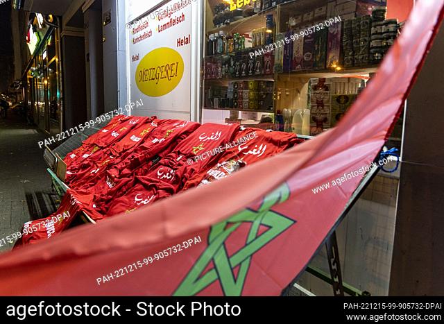 14 December 2022, North Rhine-Westphalia, Duesseldorf: Soccer, World Cup, France - Morocco, final round, semifinal, In front of a small Arab supermarket on...