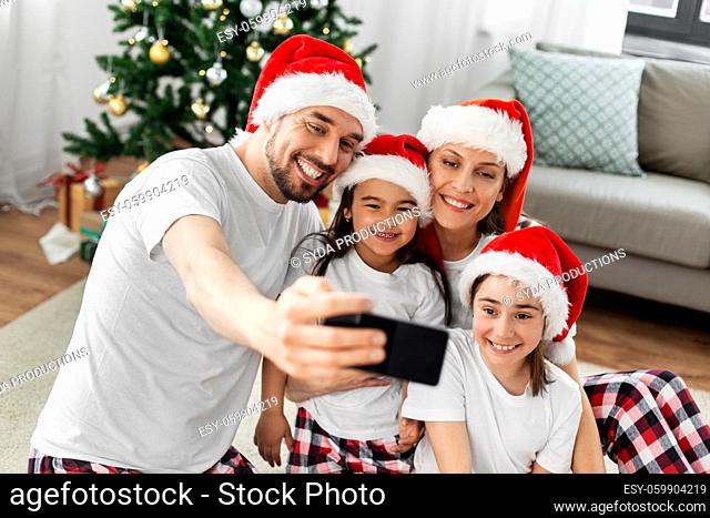 happy family taking selfie on christmas at home