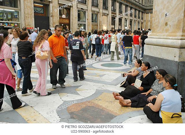Gypsies begging at Galleria Umberto I. Naples. Italy