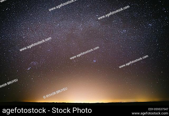 Real Night Sky Stars Background With Natural Colourful Sky Gradient. Sunset, Sunrise Light And Starry Sky. Yellow And Blue Colors Over Horizon