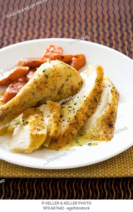 Sliced Roast Chicken on a Plate with Carrots