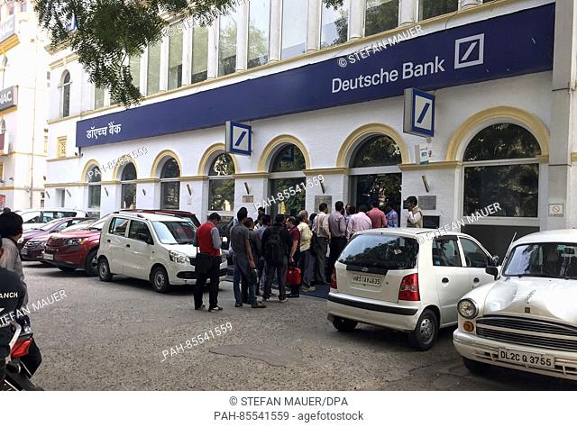 A large crowd gathers outside a branch of the Deutsche Bank in New Delhi, India, 10 November 2016. The country's banks reopened for the first time in the wake...
