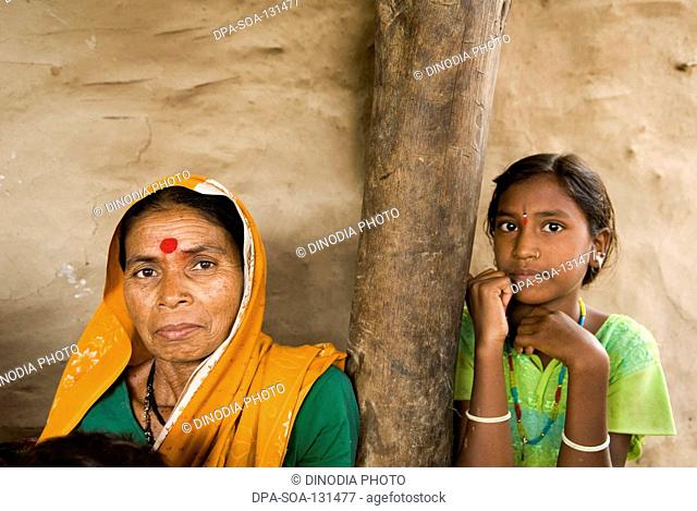 Woman seating with her daughter ; Marathwada ; Maharashtra ; India