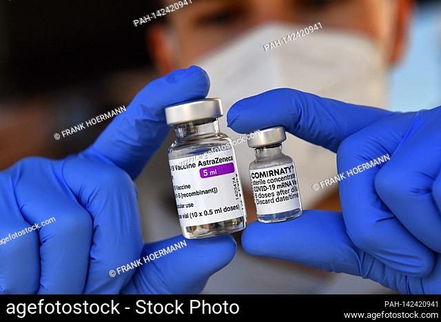 Topic picture - Comirnaty vaccine from BionTech and AstraZeneca Corona vaccine. Vaccine doses with vaccine for injection with a cannula. Close up