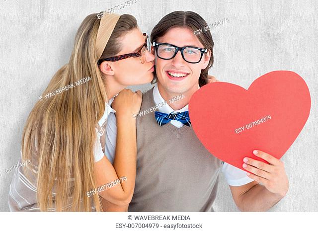 Composite image of smiling geeky hipster and his girlfriend