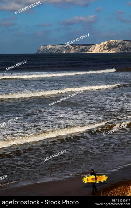 england, isle of wight, coastal view surfers at brightstone bay