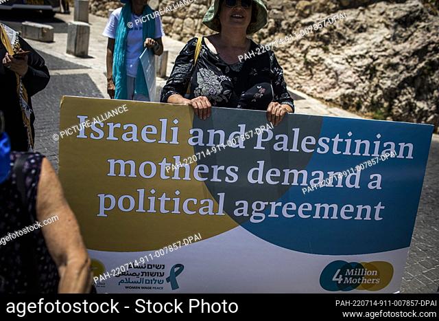 14 August 2022, Israel, Jerusalem: Israeli and Palestinian women take part in a protest to call on US President Joe Biden to be more active in promoting peace