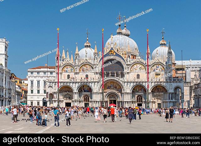 Tourists in front of St Marks Cathedral (Basilica San Marco), Piazza San Marco, Venice, Veneto, Italy