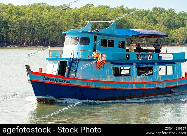The slow boat ferry from the island of Ko Chang reaches the harbor of Ranong. The ferry transports all goods and things to the islands of Ko Phayam and Ko Chang