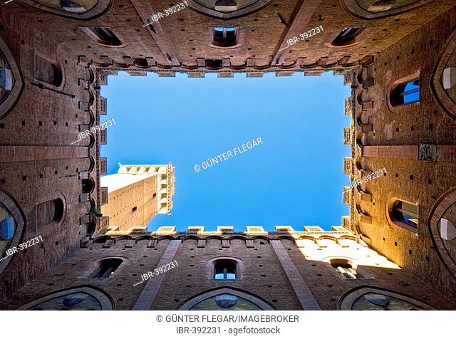 Look from the courtyard of the Palazzo Pubblico on the Torre del Mangia Siena Tuscany Italy