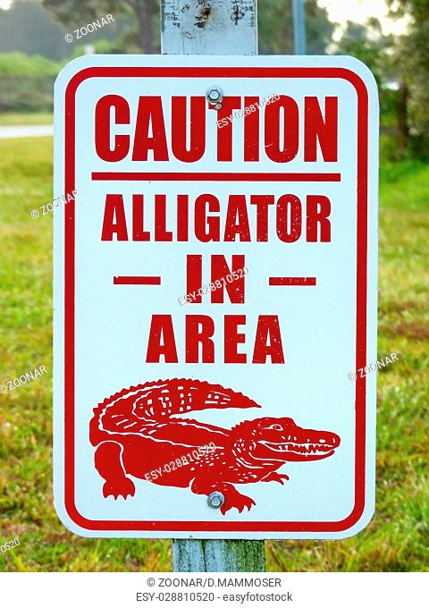 Alligator in the area caution sign