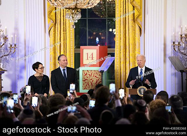 United States President Joe Biden speaks as second gentleman Doug Emhoff, and Senior Rabbi at Central Synagogue in New York City Angela Buchdahl look on during...