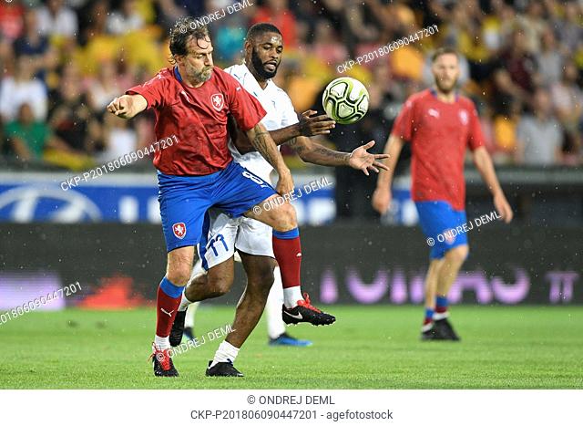 Karel Poborsky of Czech Team, left, and Alex Song of TR10 World Team in action during the match. Former captain of the Czech national football team Tomas...