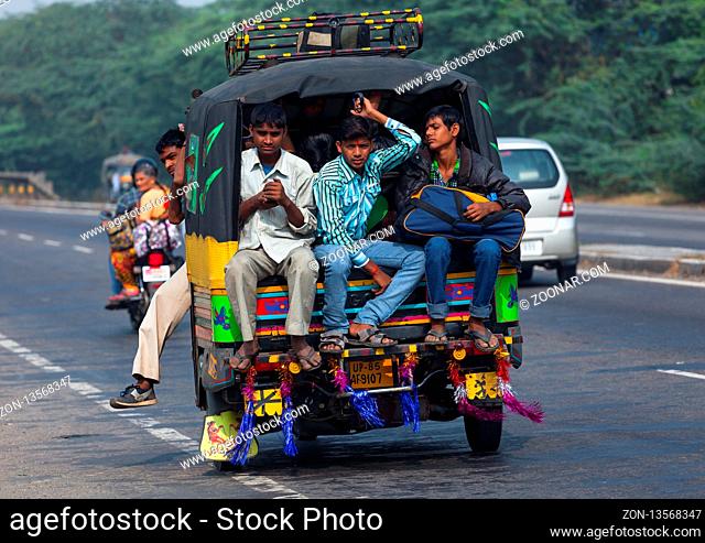 AGRA, INDIA - NOVEMBER 15, 2012: Traditional Indian family travels by car. Indian people and their colorful culture