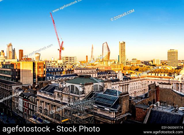 Cityscape of the City of London. High angle view a sunny day at sunset