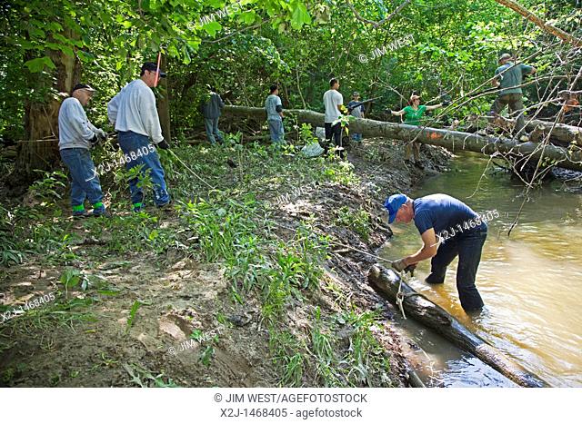 Southfield, Michigan - Volunteers clear a logjam from the Rouge River  They were part of the Rouge Rescue, an annual volunteer cleanup of the Rouge and...