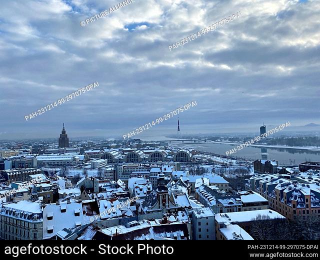 14 December 2023, Latvia, Riga: Panoramic view of the market halls and the television tower from St. Peter's Church. Photo: Alexander Welscher/dpa