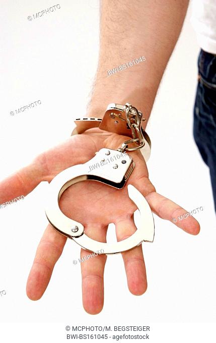 man with opened handcuffs