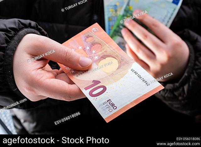 Hands giving euro banknotes currencies as financial activity