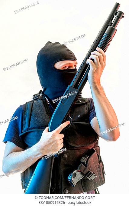 man armed with balaclava and bulletproof vest, gun and shotgun, kalashnikov