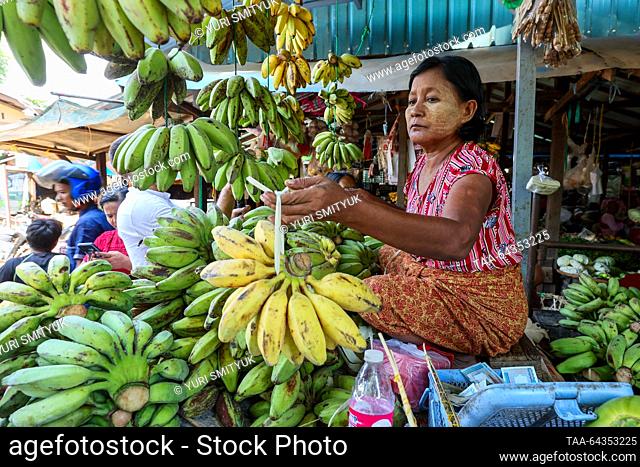 MYANMAR, BAGAN - OCTOBER 28, 2023: A woman sells bananas at Nyaung U Market. Yuri Smityuk/TASS