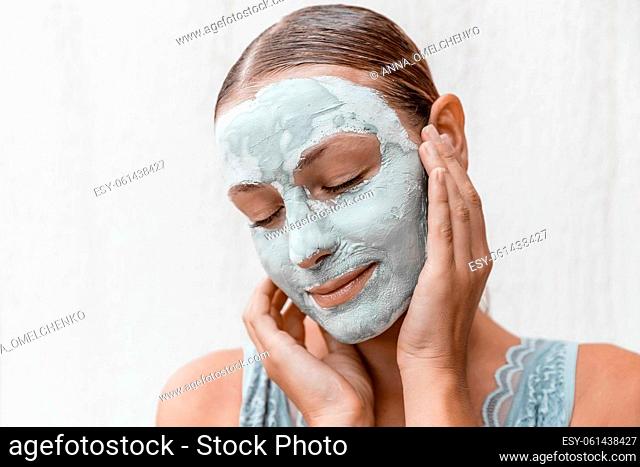 Portrait of a Beautiful Woman with Closed Eyes Enjoying Dayspa and Beauty Treatment. Isolated on White Background