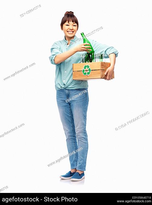 smiling young asian woman sorting glass waste