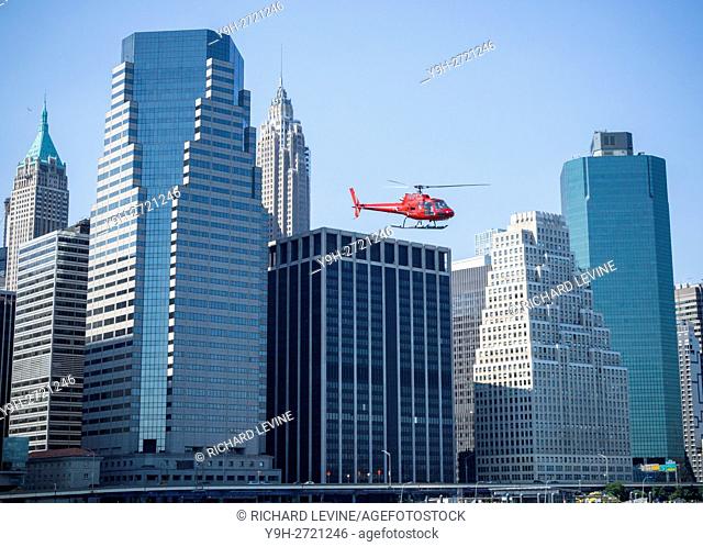 A sightseeing helicopter departs the Downtown Heliport in New York